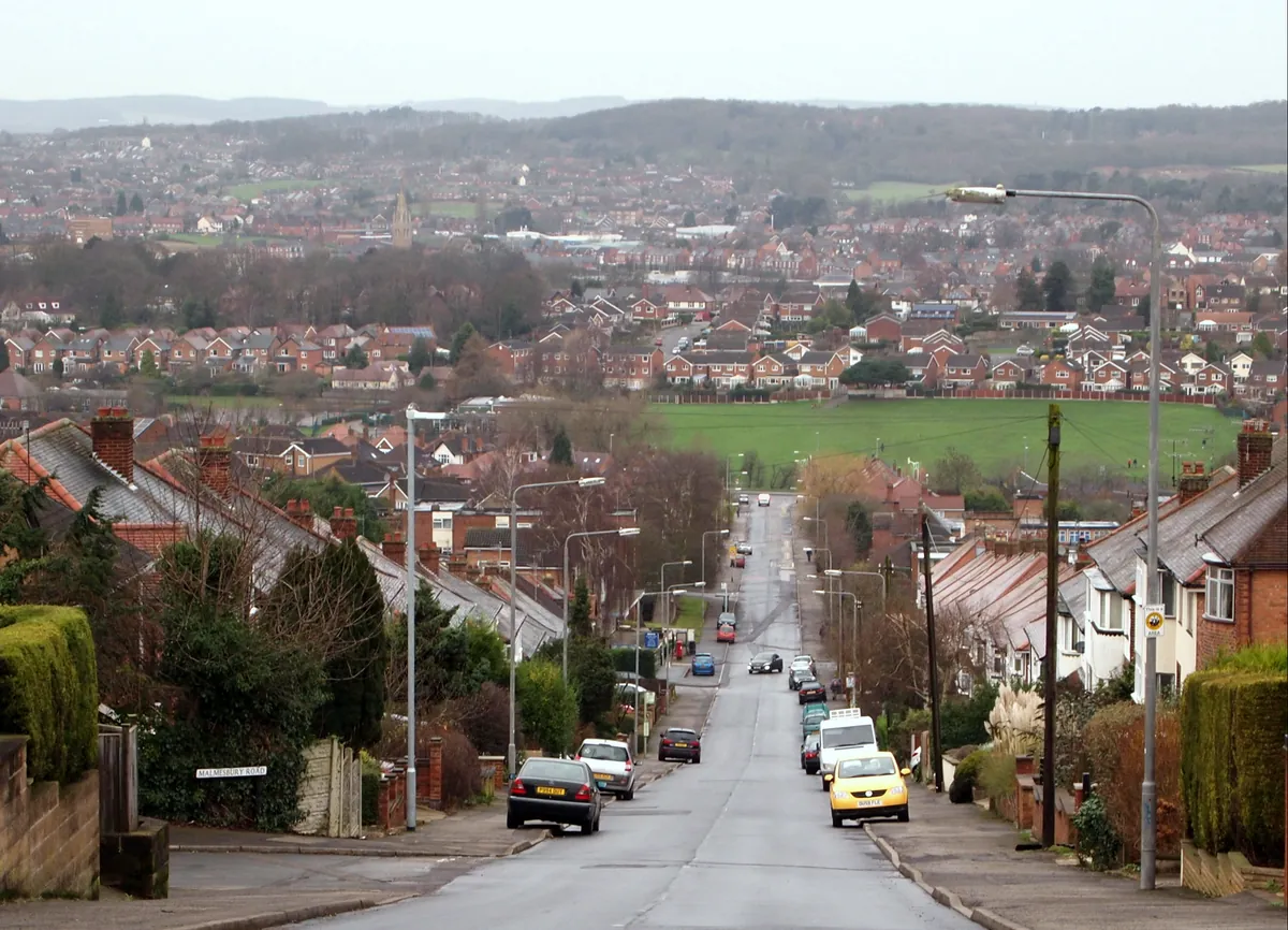 Semi-detached houses lining Somersby Road in Arnold, looking down over the town