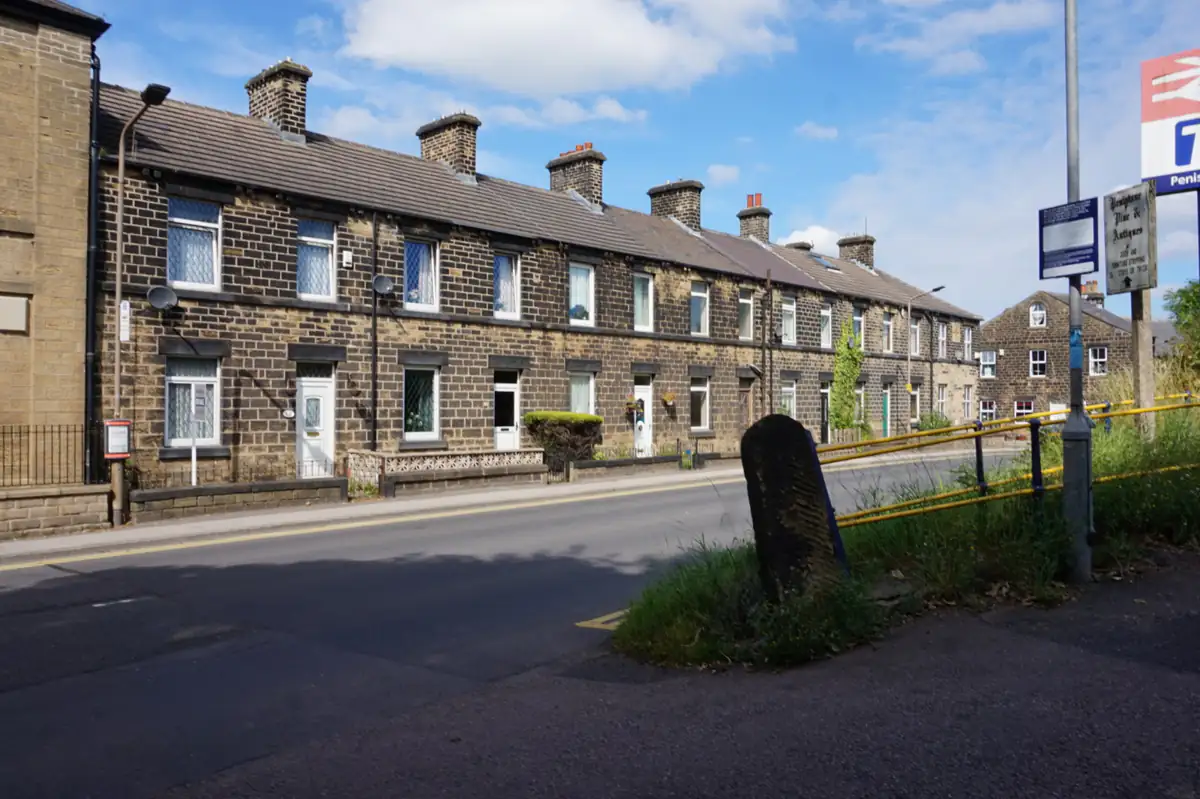 A row of stone terraced houses on Sheffield Road in Penistone