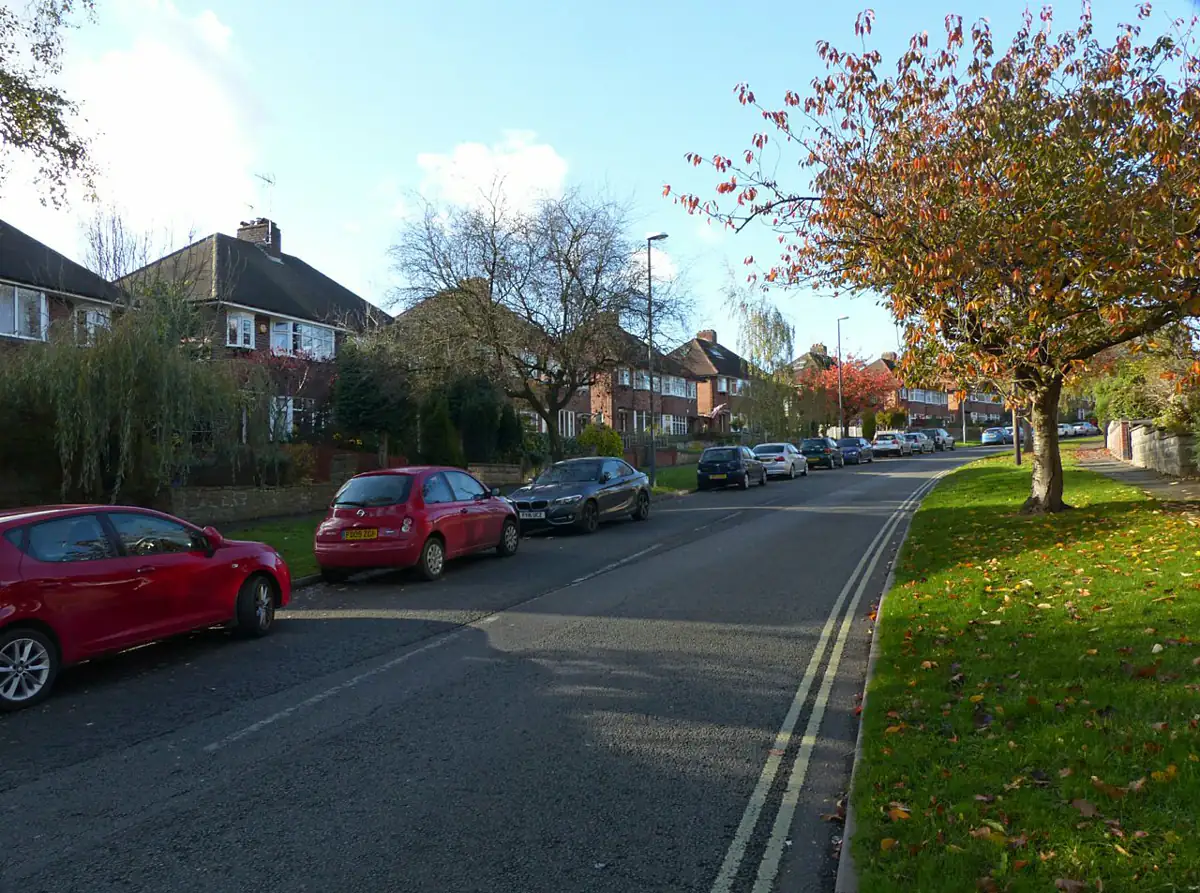 Semi-detached houses and autumn trees on Hillsway in Littleover